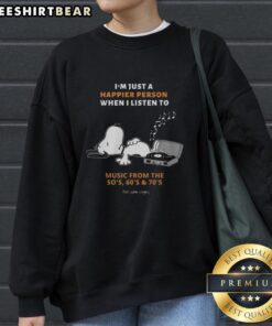 Alt Text: Premium Snoopy sweatshirt featuring I'm Just A Happier Person When I Listen To Music design from the '50s, '60s, and '70s.