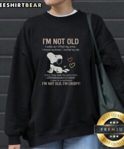 Alt Text: Premium Snoopy I'm Not Old, I'm Crispy Sweatshirt featuring a playful graphic of Snoopy and vibrant colors.