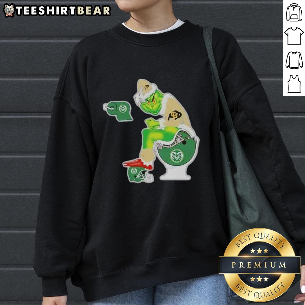 Premium The Grinch Colorado Buffaloes Sitting On Toilet Colorado State Rams Xmas Holiday Christmas Sweatshirt Premium The Grinch Colorado Buffaloes sweatshirt featuring a playful design of The Grinch on a toilet for Christmas.