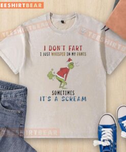 Premium The Grinch 'I Don't Fart, I Just Whisper' T-Shirt in a casual setting, showcasing fun holiday humor.