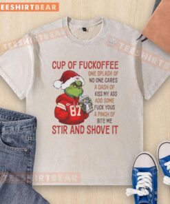 Alt Text: Premium Grinch Kansas City Chiefs Cup of Coffee t-shirt featuring humorous text for fans and gift seekers.