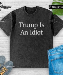 Premium Trump Is An Idiot washed t-shirt featuring bold text design, perfect for casual style and political humor.