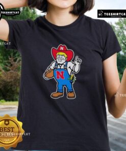 Andrew Whitworth and Ryan Fitzpatrick in Nebraska Huskers Herbie mascot ladies tee, showcasing team spirit and style.