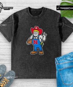 Andrew Whitworth and Ryan Fitzpatrick in Nebraska Huskers Herbie mascot washed t-shirts, showcasing team spirit.