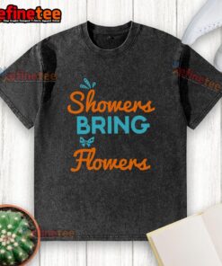 Stylish washed t-shirt featuring 'April Showers Bring May Flowers' design, perfect for spring fashion and casual wear.