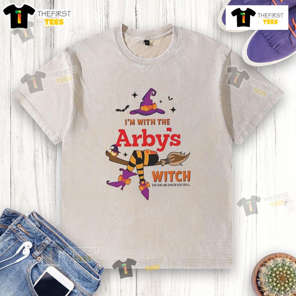 Pretty Arby's I'm With The Witch She Has Me Under Her Spell Halloween Washed T-Shirt Pretty Arbys Halloween washed t-shirt featuring a witch and the phrase 'She Has Me Under Her Spell' in vibrant colors.