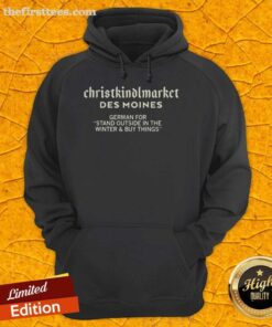 Visitors at Christkindlmarket Des Moines winter market, browsing German goods and cozying up in festive hoodies.