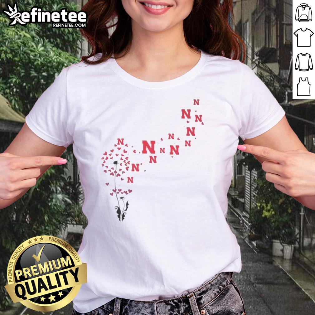 pretty-dandelion-flower-nebraska-huskers-football-logo-ladies-tee Pretty dandelion flower design with Nebraska Huskers football logo on a ladies' tee shirt, perfect for fans.