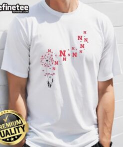 Pretty dandelion flower design on Nebraska Huskers football logo T-shirt, perfect for fans and floral enthusiasts.
