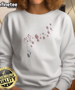 Alt Text: Oklahoma Sooners football logo sweatshirt featuring a pretty dandelion flower design, ideal for fans and casual wear.