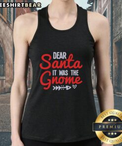 Woman wearing a 'Dear Santa It Was The Gnome' tank top, showcasing a fun holiday design perfect for festive celebrations.