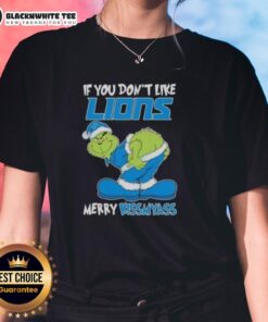 Pretty Grinch Christmas tee for ladies: 'If You Don't Like Detroit Lions, Merry Kiss My Ass' festive design.