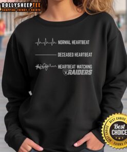 Alt Text: Stylish Pretty Heartbeat Watching Las Vegas Raiders Sweatshirt, perfect for fans supporting their team in comfort.