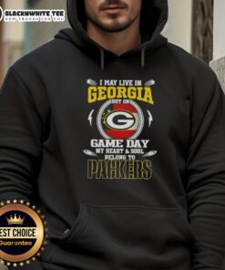 Alt Text: Woman wearing a Green Bay Packers hoodie proudly displaying her team spirit on Game Day in Georgia.