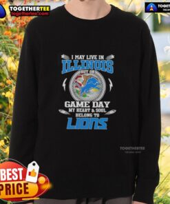 Alt Text: Woman wearing a Detroit Lions sweatshirt, showcasing pride for her team despite living in Illinois on game day.