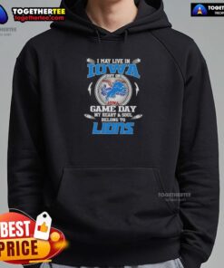 Alt Text: Woman wearing a Detroit Lions hoodie in Iowa, showcasing team spirit on game day with vibrant colors and bold design.