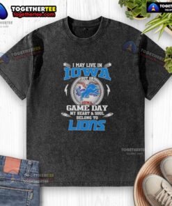 Alt Text: Stylish washed t-shirt reading 'I may live in Iowa, but my heart belongs to Detroit Lions' for game day fans.