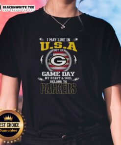 Alt Text: Green Bay Packers ladies tee featuring 'I may live in U.S.A but my heart belongs to Packers' design.