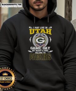 Woman wearing a Green Bay Packers hoodie in Utah, showcasing team spirit on game day with a smile.