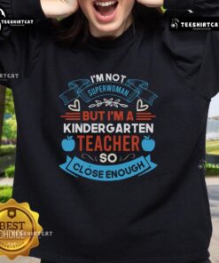 Cozy sweatshirt reading 'I'm Not Superwoman, But I'm A Kindergarten Teacher' perfect for educators and fans of teaching.