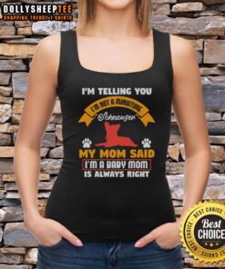 Adorable dog wearing a 'Not a Miniature Schnauzer' tank top, showcasing its playful personality and cute style.