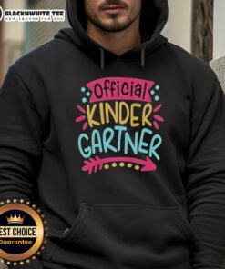 Pretty kindergartner girl in a colorful hoodie on her first day of kindergarten, smiling with excitement and joy.