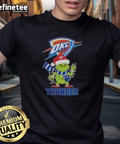Pretty Oklahoma City Thunder Christmas Grinch Santa Hat Holiday T-Shirt featuring festive designs and team colors.