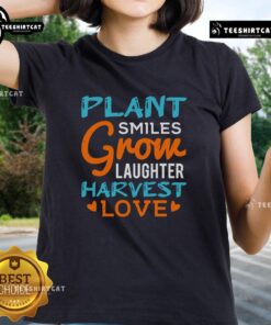Pretty Plant Smiles Grow Laughter Harvest Love Ladies Tee showcasing vibrant floral design and cheerful message.