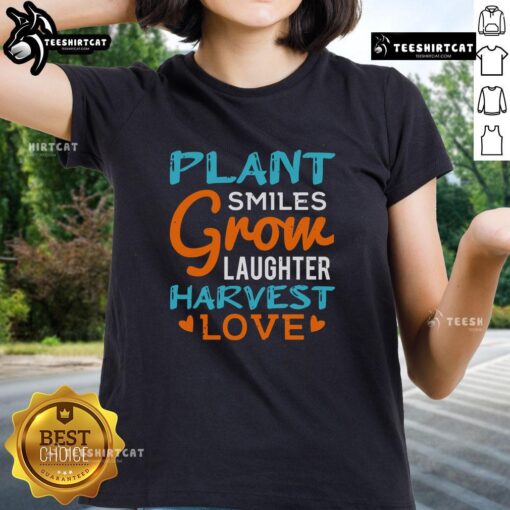 Pretty Plant Smiles Grow Laughter Harvest Love Ladies Tee showcasing vibrant floral design and cheerful message.
