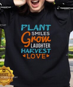Alt Text: Cozy sweatshirt featuring 'Pretty Plant Smiles Grow Laughter Harvest Love' design, perfect for plant lovers and positivity.