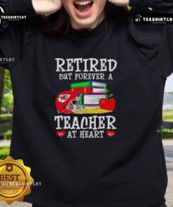 Cozy Kansas City Chiefs sweatshirt with 'Pretty Retired But Forever A Teacher At Heart' design, perfect for fans.