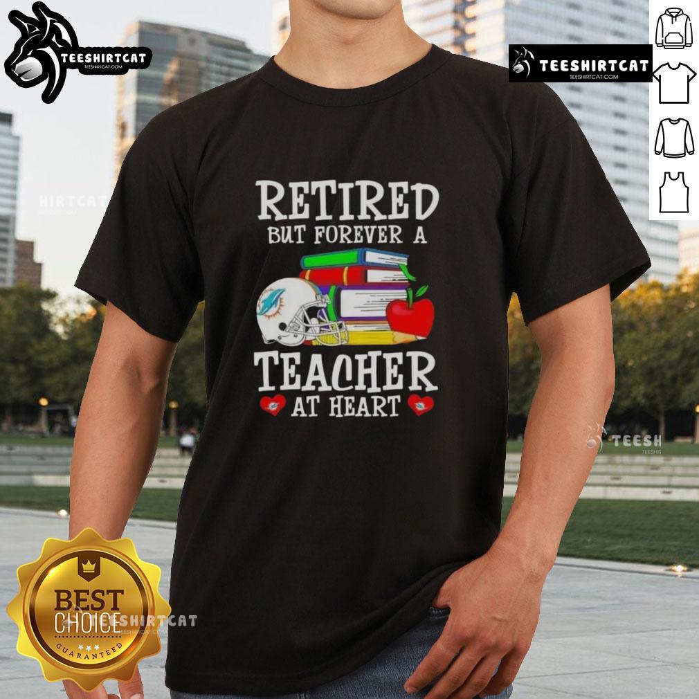 Pretty Retired But Forever A Teacher At Heart Miami Dolphins Football T Shirt Pretty retired but forever a teacher at heart Miami Dolphins football T-shirt displayed on a mannequin in a bright setting.