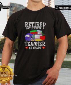 Pretty retired but forever a teacher at heart Minnesota Vikings football T-shirt displayed on a hanger.