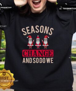 Cozy Christmas sweatshirt featuring seasonal change design, perfect for celebrating the holidays in style.
