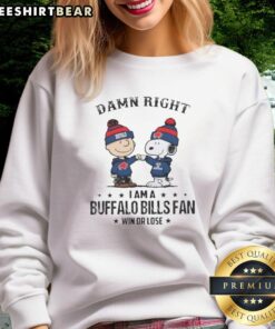 Pretty Snoopy and Charlie Brown sweatshirt for Buffalo Bills fans, showcasing team spirit with 'Damn Right I Am' slogan.