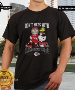 Pretty Snoopy and Charlie Brown Peanuts shirt featuring 'Don't Mess With Kansas City Chiefs' football design.