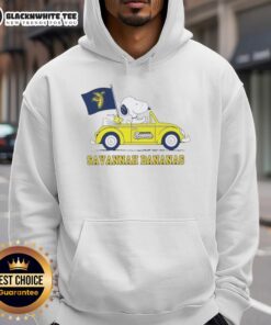 Snoopy in a car wearing a Savannah Bananas hoodie, showcasing a fun and colorful design for fans.