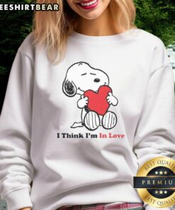 Pretty Snoopy I Think I'm In Love sweatshirt featuring a cute design of Snoopy with hearts, perfect for casual wear.