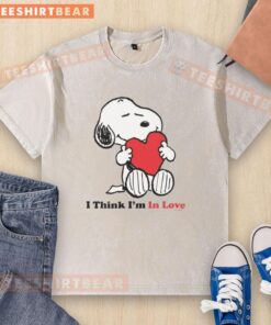 Pretty Snoopy 'I Think I'm In Love' washed t-shirt featuring a cute Snoopy graphic on a soft, casual tee.