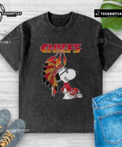 Pretty Snoopy War Bonnets Kansas City Chiefs football helmet on a washed t-shirt, showcasing playful sports apparel design.