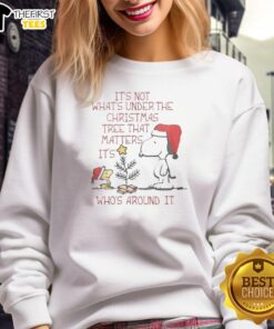 Pretty Snoopy and Woodstock sweatshirt featuring the quote: 'It's not what's under the Christmas tree, it's who's around it.'