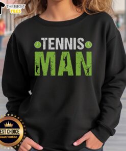 Stylish man in a pretty tennis sweatshirt, showcasing sporty fashion and comfort on the court.