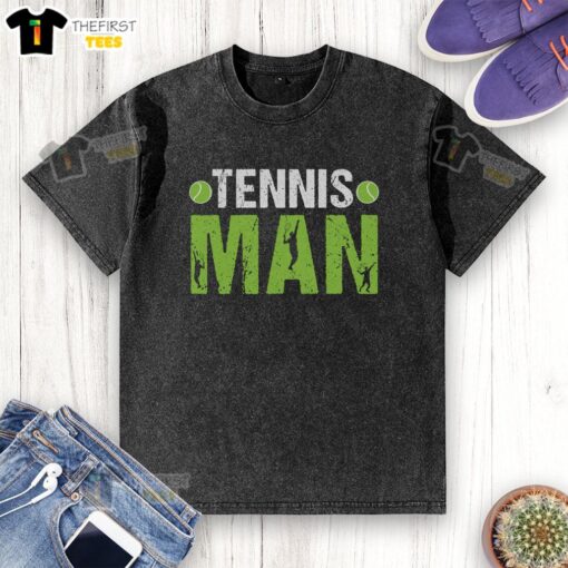 Stylish man in a washed t-shirt playing tennis on a sunny court, showcasing athletic wear and a competitive spirit.