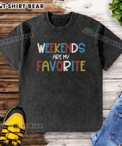 Pretty Weekends Are My Favorite washed t-shirt displayed on a rustic wooden background, showcasing its casual style.