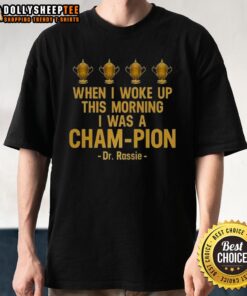 Pretty When I Woke Up This Morning I Was A Cham-Pion Dr. Rassie T-Shirt design featuring vibrant graphics and bold text.