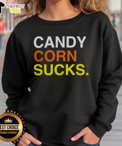 Cozy Top Candy Corn Sucks sweatshirt featuring a fun graphic, perfect for Halloween enthusiasts and candy corn haters.