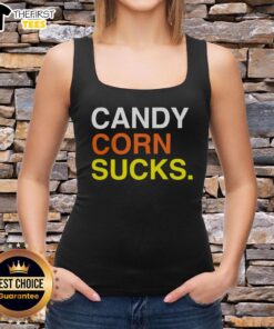 Trendy tank top featuring 'Top Candy Corn Sucks' graphic, perfect for Halloween-themed fashion and candy corn haters.