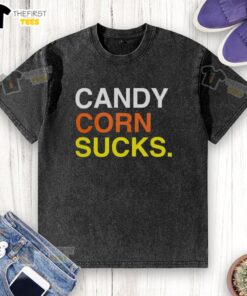 Top Candy Corn Sucks washed t-shirt featuring a fun graphic design, perfect for Halloween festivities and candy lovers.