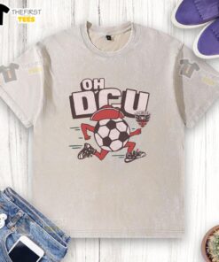 Alt Text: Top D.C. United Oh DCU washed t-shirt in navy blue, showcasing team pride and casual style for soccer fans.