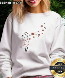 Top view of a Dandelion flower design on a Cincinnati Bengals football logo sweatshirt for fans.